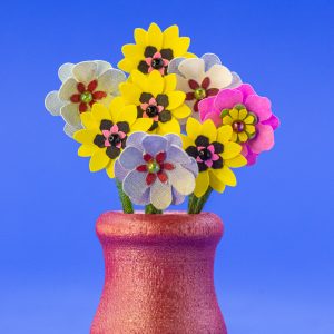 1-inch-tall red wood vase with punch flowers.