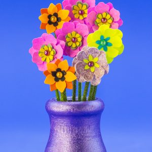 Wood vase with punch flowers.