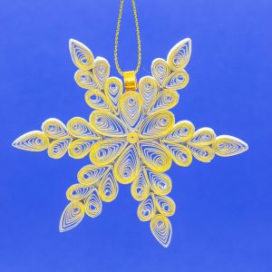 This snowflake is 3" x 3" x 1/4" and is made with white paper and gold gilding on one side. The other side is white with gold rhinestones.