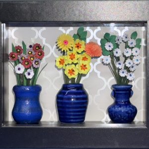 Adorable miniature floral shadow box with white, yellow and red flowers