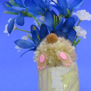 This cute bunny is digging in the ceramic flowerpot with and all you can see is his behind. The overall size is 5x3.5".