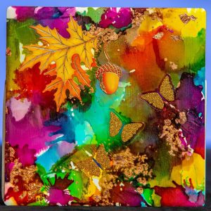 This one-of-a-kind design is created with Alcohol Ink that creates interesting images. This coaster is 4x4 with a felt backing and contains fall stickers.