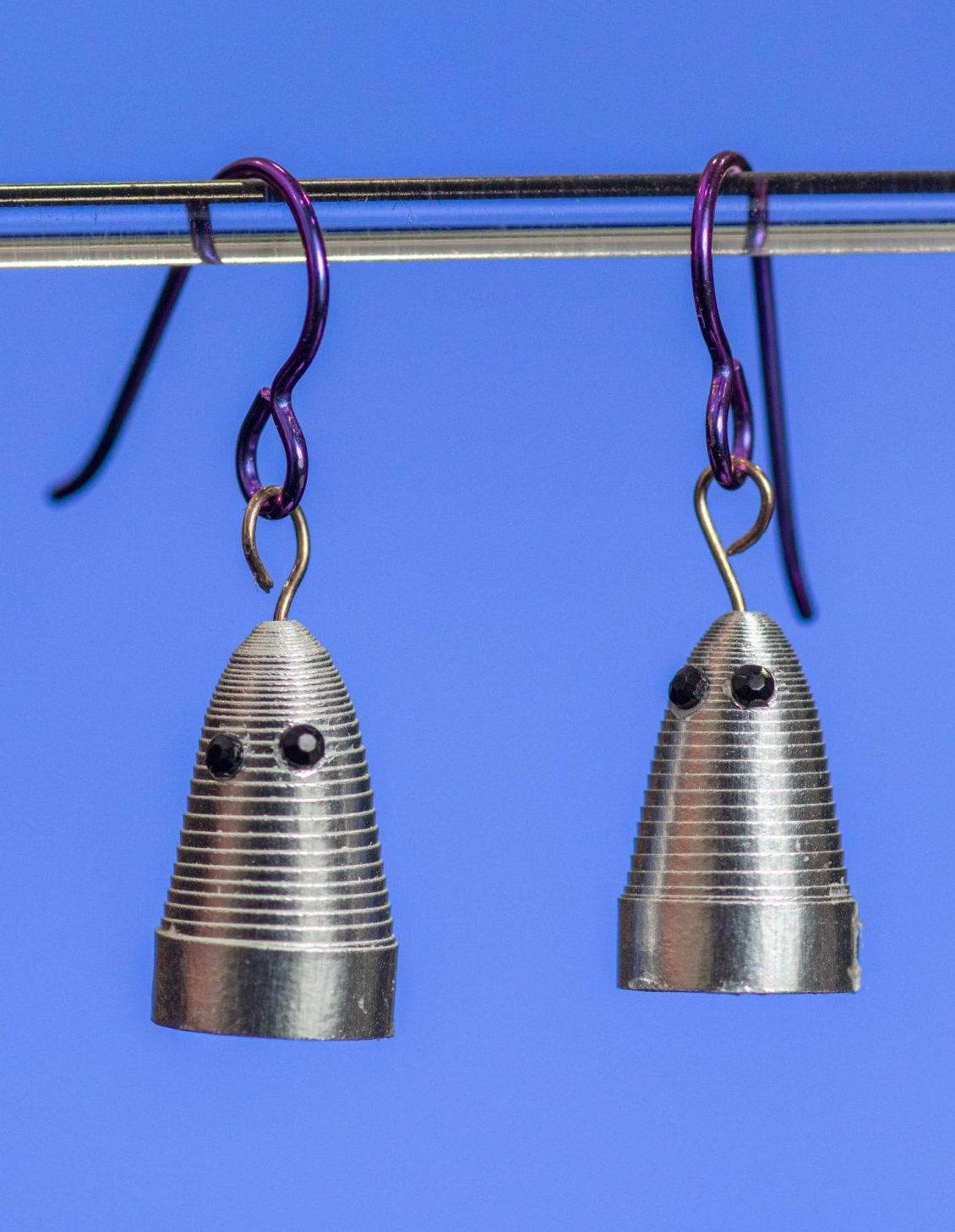 This small pair of silver ghosts are just hanging out waiting for Halloween and you. They are made with 1/8″ shiny silver paper